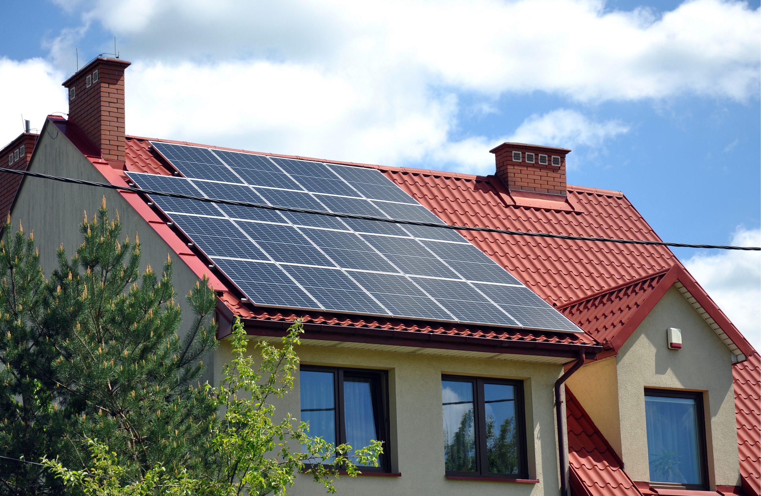 Solar panels installed on red tile roof of Arizona home providing backup power during outages