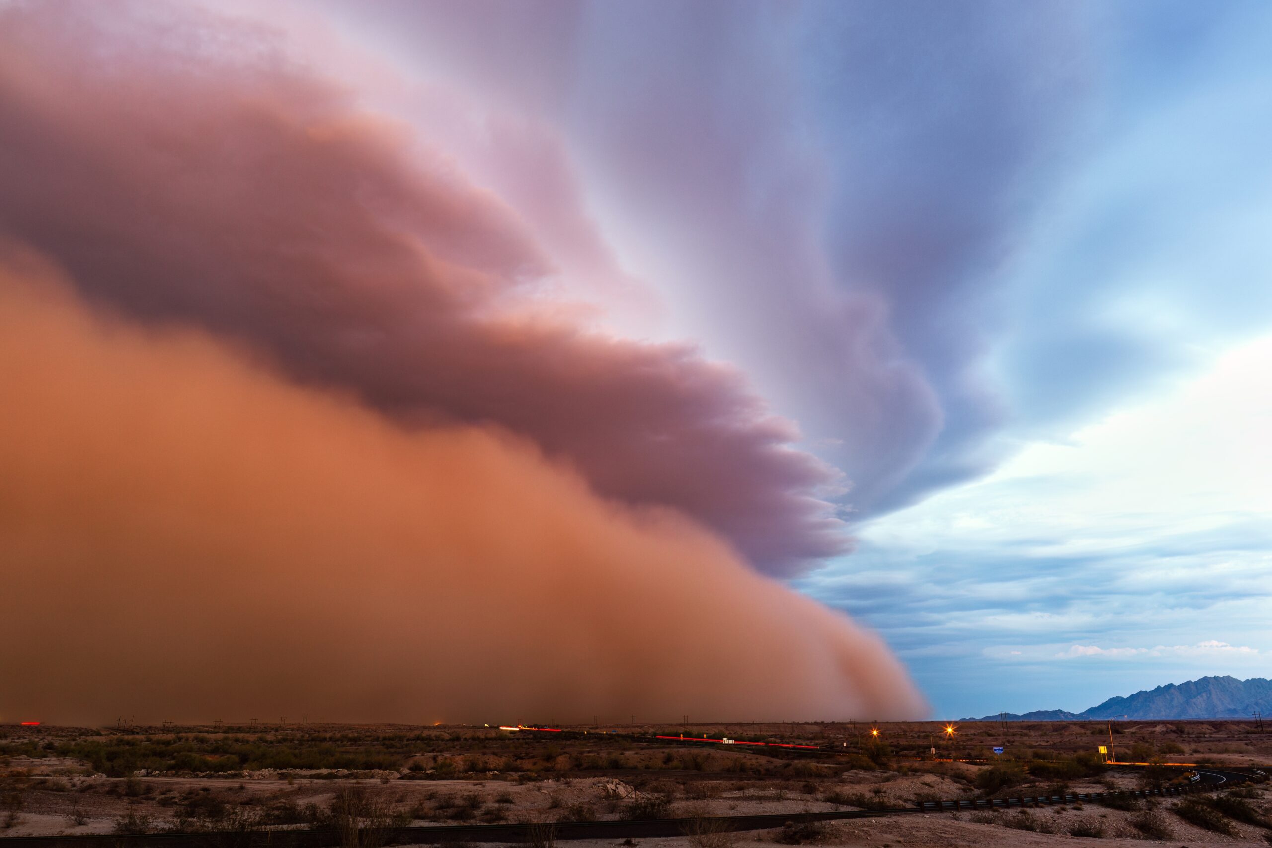 A massive haboob dust storm sweeps across the Arizona desert at dusk, illustrating how Arizona weather impacts power reliability during monsoon season.
